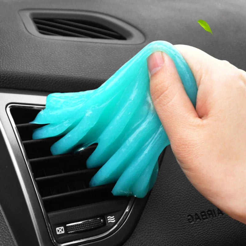 Interior cleaning gel putty lifting dust from a vent